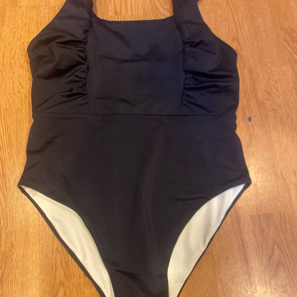 1 people navy one piece bathing suit size large. NWT.